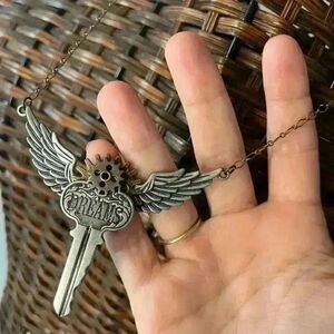 Steampunk Articulating dreams key and wings necklace with mixed metals